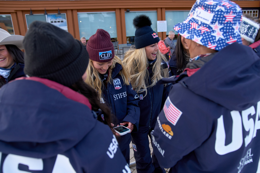 Members of the U.S. Women's Ski Team including Lindsey Vonn, center, with Tricia Mangan, of Buffalo, NY, left, joke together after making a dancing video for social media at Copper Mountain, Colo., Nov. 19, 2025. (AP Photo/Jacquelyn Martin)