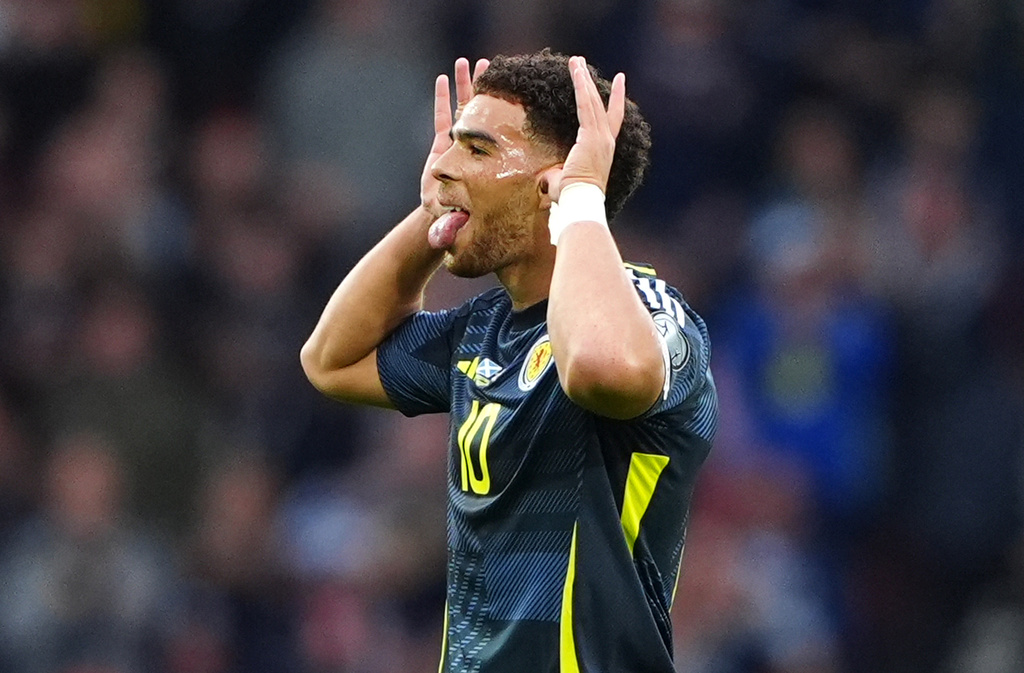Scotland's Che Adams celebrates scoring their side's first goal during during the World Cup 2026 group C qualifying soccer match between Scotland and Belarus at Hampden Park in Glasgow, Scotland, Sunday, Oct. 12, 2025. (Owen Humphreys/PA via AP)
