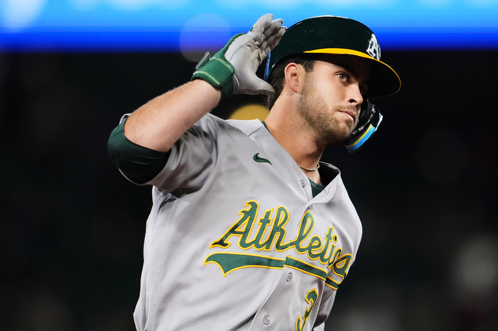 Athletics' Max Muncy reacts as he jogs the bases after hitting a solo home run against the Seattle Mariners during the third inning of a baseball game, Friday, Sept. 4, 2026, in Seattle. (AP Photo/Lindsey Wasson)