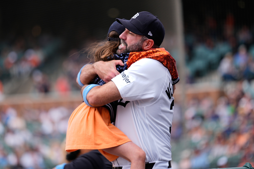 Detroit Tigers' Justin Verlander hugs his daughter Genevieve for Father's Day before a baseball game against the Chicago White Sox Sunday, June 21, 2026, in Detroit. (AP Photo/Paul Sancya).
