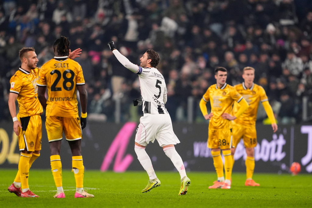Juventus's Manuel Locatelli, center, celebrates after scoring his side's second goal during the Italian soccer cup round of sixteen match between Juventus FC and Udinese in Turin, Italy , Dec. 2, 2025. (Fabio Ferrari/LaPresse via AP)