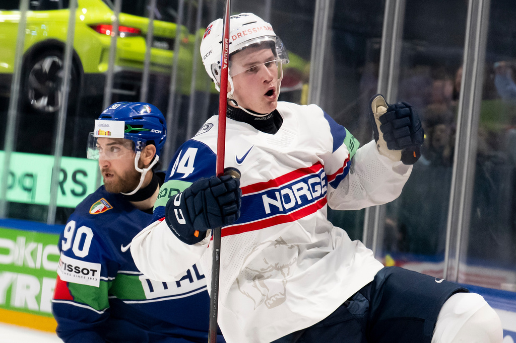 Norway's Tinus Luc Koblar celebrates scoring during the Men's Ice Hockey World Championship preliminary round match between Italy and Norway in Fribourg, Switzerland, Tuesday, May 19, 2026. (Anthony Anex/Keystone via AP)