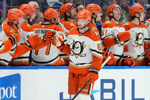 Anaheim Ducks defenseman Jacob Trouba (65) celebrates with the bench after scoring against the Tampa Bay Lightning during the second period of an NHL hockey game Saturday, Oct. 25, 2025, in Tampa, Fla. (AP Photo/Chris O'Meara) Anaheim Ducks defenseman Jacob Trouba (65) celebrates with the bench after scoring against the Tampa Bay Lightning during the second period of an NHL hockey game Saturday, Oct. 25, 2025, in Tampa, Fla. (AP Photo/Chris O'Meara)