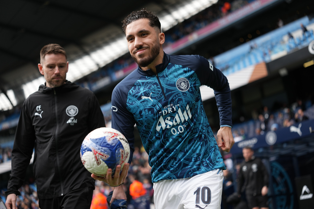Manchester City's Rayan Cherki enters the pitch before the FA Cup quarter-final soccer match between Manchester City and Liverpool in Manchester, England, Saturday, April 4, 2026. (AP Photo/Jon Super)