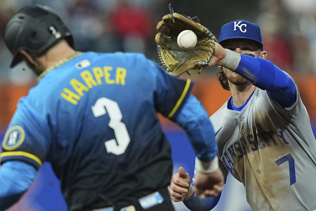 Philadelphia Phillies' Bryce Harper (3) is forced out by Kansas City Royals shortstop Bobby Witt Jr. during the fourth inning of a baseball game, Friday, Sept. 12, 2025, in Philadelphia. (AP Photo/Matt Rourke)