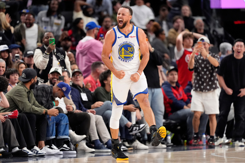 Golden State Warriors guard Stephen Curry celebrates after scoring during the second half of an NBA play-in tournament basketball game against the LA Clippers, Wednesday, April 15, 2026, in Inglewood, Calif. (AP Photo/Mark J. Terrill)