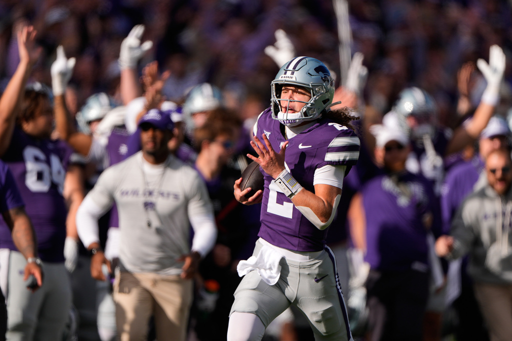 Kansas State quarterback Avery Johnson runs for a touchdown during the first half of an NCAA college football game against Texas Tech, Saturday, Nov. 1, 2025, in Manhattan, Kan. (AP Photo/Charlie Riedel)