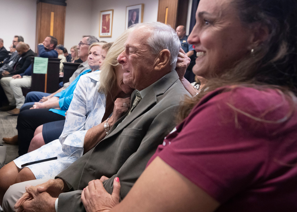 Surrounded by friends and family, Tim Miller, father of Laura Miller, reacts after James Dolphs Elmore Jr. was found guilty of manslaughter in the death of Laura Miller, Wednesday, Sept. 2, 2026, in Galveston, Texas. (Stuart Villanueva/The Galveston County Daily News via AP, Pool)