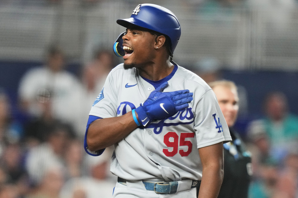 Los Angeles Dodgers' Josue de Paula (95) reacts after hitting a three run home run during the fourth inning of a baseball game against the Miami Marlins, Sunday, Sept. 13, 2026, in Miami. (AP Photo/Lynne Sladky)