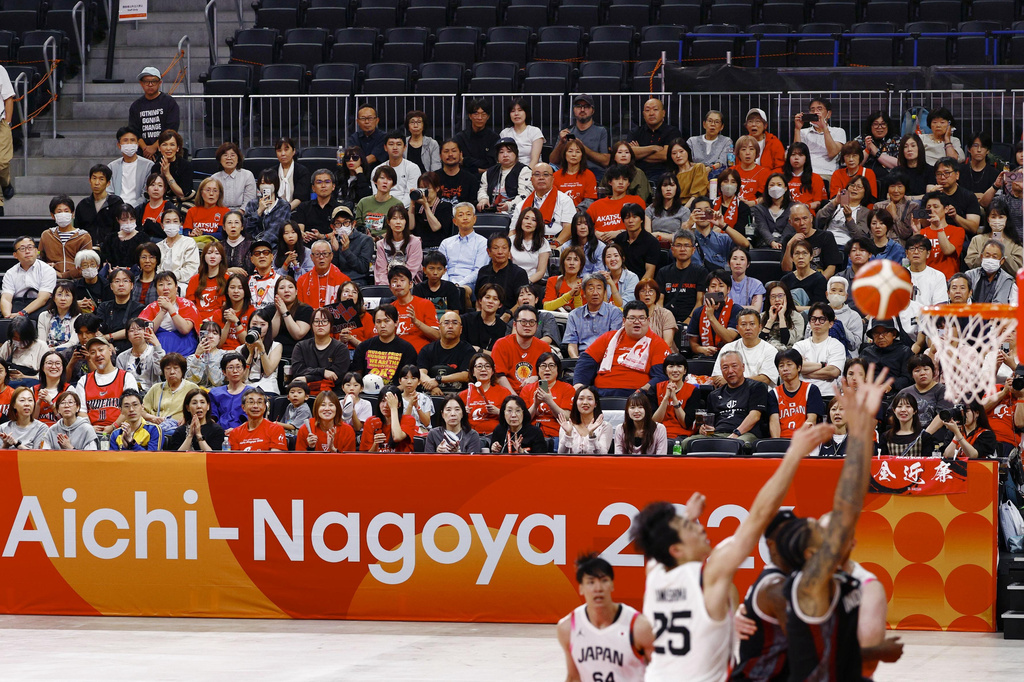 Team Japan players, in white, play against team Indonesia during their basketball game in the Asian Games in Nagoya, central Japan, on Sept. 10, 2026. (Natsumi Yasumoto/Kyodo News via AP)