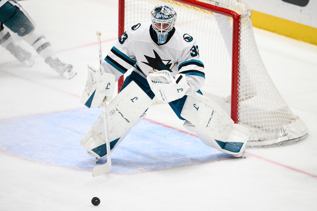 San Jose Sharks goaltender Alex Nedeljkovic (33) watches the puck during the third period of an NHL hockey game against the Washington Capitals, Thursday, Jan. 15, 2026, in Washington. (AP Photo/Nick Wass)