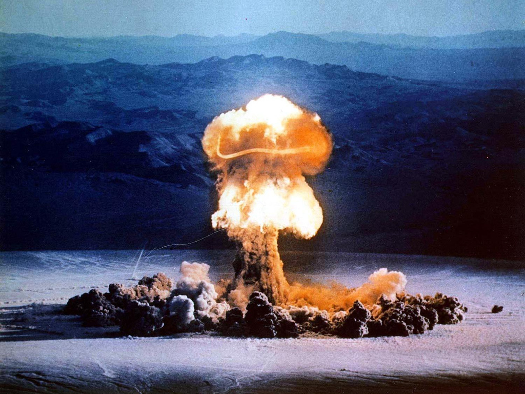 FILE - A mushroom cloud rises from a test blast at the Nevada Test Site on June 24, 1957. (U.S. Energy Department via AP, File)