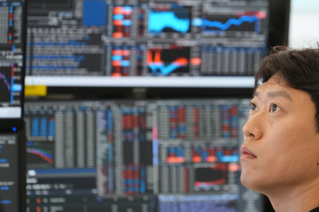 A dealer watches computer monitors at a dealing room of Hana Bank in Seoul, South Korea, Tuesday, June 16, 2026. (AP Photo/Lee Jin-man)