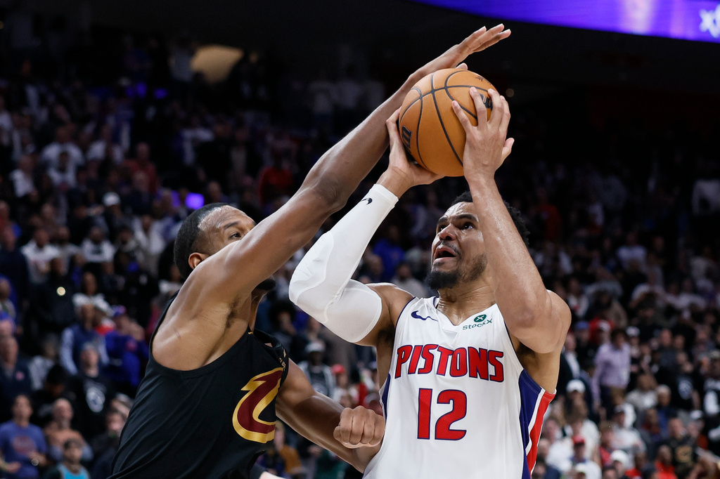 Detroit Pistons forward Tobias Harris (12) tries to get a shot off against Cleveland Cavaliers center Evan Mobley (4) during the second half in Game 1 of a second-round NBA playoffs basketball series Tuesday, May 5, 2026, in Detroit. (AP Photo/Duane Burleson)