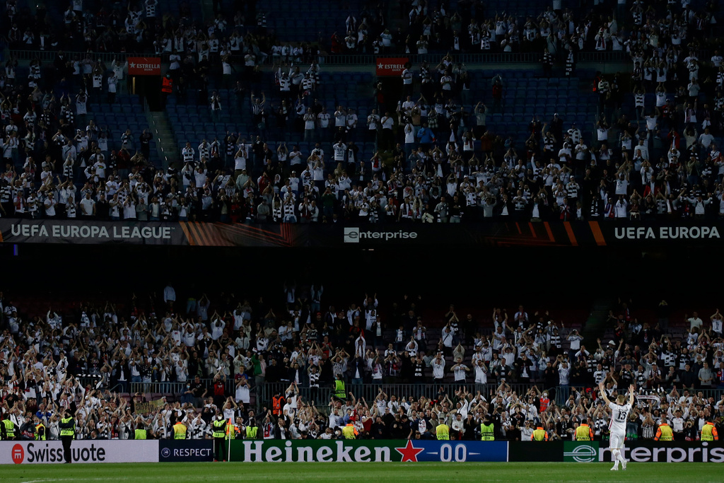 FILE - Frankfurt's Martin Hinteregger applauds fans after winning the Europa League, second leg, quarterfinal soccer match against Barcelona at the Camp Nou stadium, in Barcelona, Spain, Thursday, April 14, 2022. (AP Photo/Joan Monfort, file)