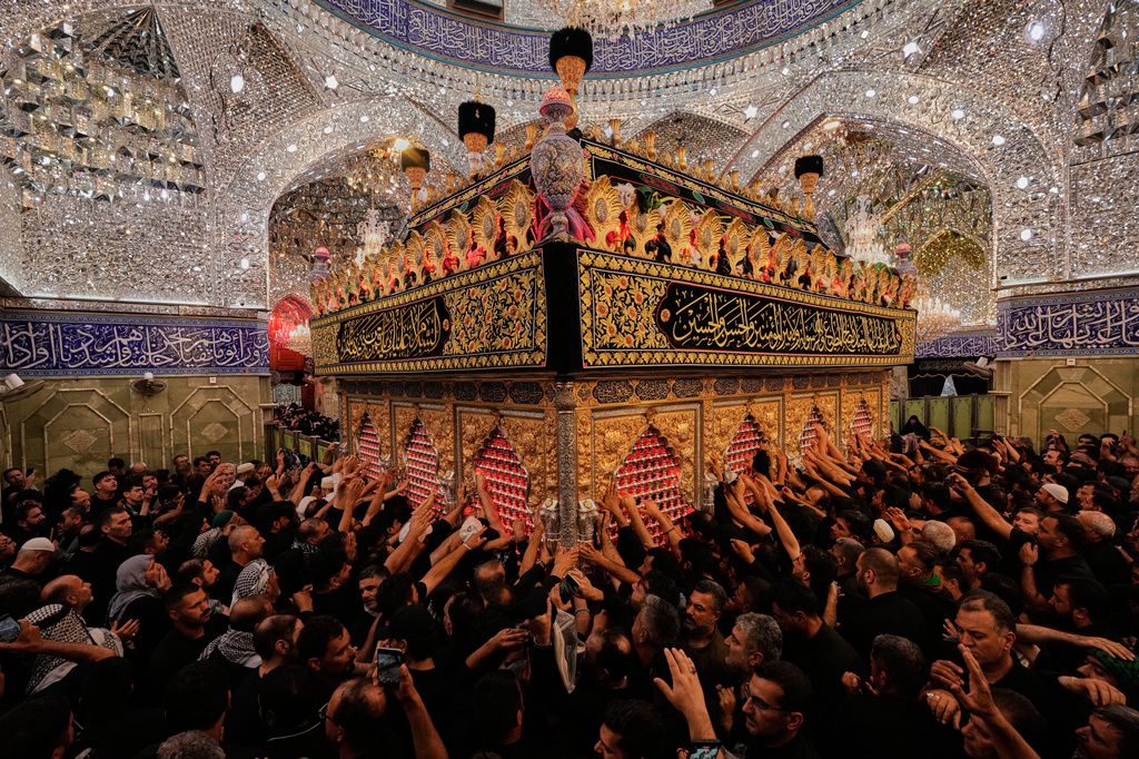 Shiite worshippers visit the holy shrine of Imam Abbas, during Muharram, a period of mourning for Shiites, in Karbala, Iraq, Iraq, Thursday, June 25, 2025. (AP Photo/Hadi Mizban)