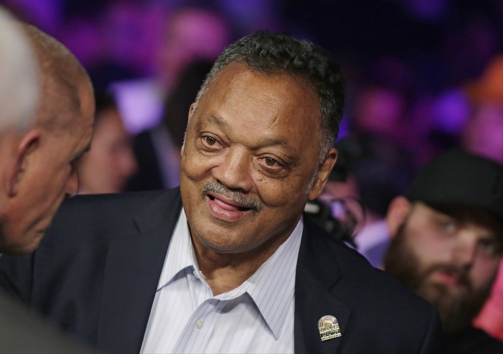 FILE - Jesse Jackson joins the crowd before the start of the world welterweight championship bout between Floyd Mayweather Jr., and Manny Pacquiao in Las Vegas on May 2, 2015. (AP Photo/Isaac Brekken, File)