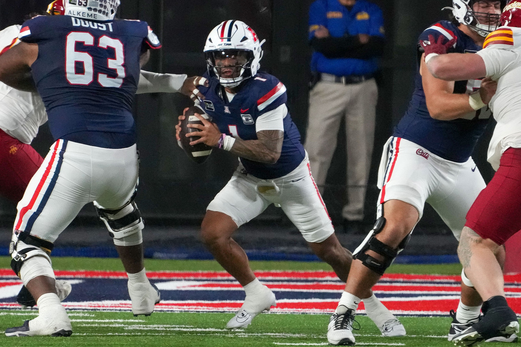 Arizona quarterback Noah Fifita (1) scrambles out of the pocket during the second half of an NCAA college football game against Iowa State, Saturday, Oct. 24, 2026, in Tucson, Ariz. (AP Photo/Darryl Webb)