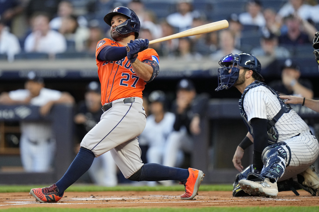 Houston Astros' Jose Altuve (27) hits a two-run home run during the first inning of a baseball game against the New York Yankee Friday, Aug. 8, 2025, in New York. (AP Photo/Frank Franklin II)