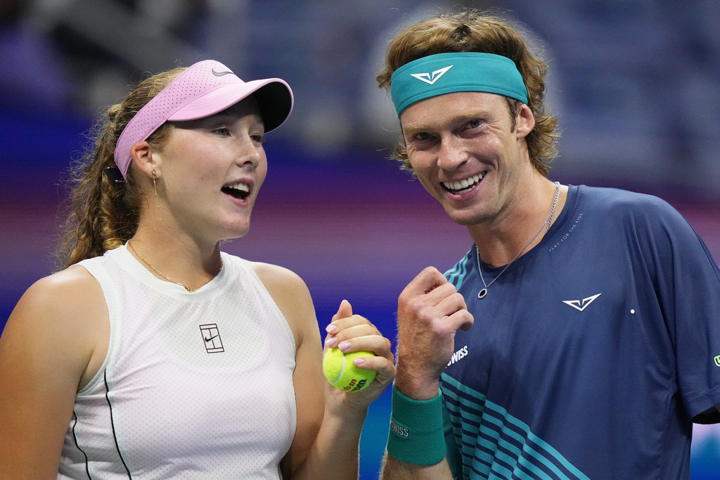 Mirra Andreeva, left, of Russia, and Andrey Rublev, of Russia, talk during a mixed doubles semifinal match against Jakub Mensik, of the Czech Republic, and Karolina Muchova, of the Czech Republic, at the U.S. Open tennis championships Wednesday, Aug. 26, 2026, in New York. (AP Photo/Frank Franklin II)