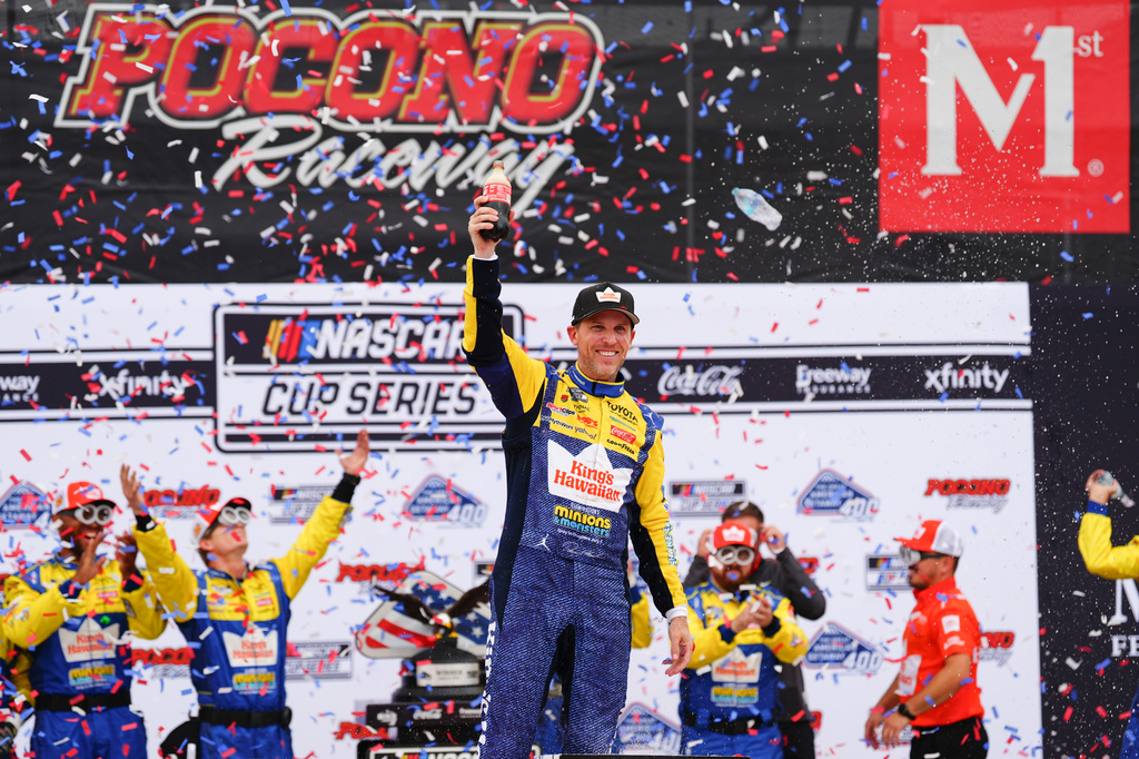 Denny Hamlin celebrates in Victory Lane after winning a NASCAR Cup Series auto race at Pocono Raceway, Sunday, June 14, 2026, in Long Pond, Pa. (AP Photo/Derik Hamilton)