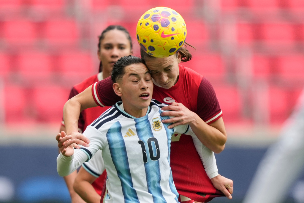 Argentina midfielder Maricel Pereyra (10) battle for a header with Canada defender Marie Levasseur (28) during the first half of a SheBelieves Cup women's soccer match, Saturday, March 7, 2026, in Harrison, N.J. (AP Photo/Yuki Iwamura)