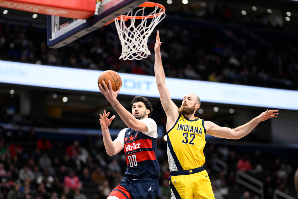 Washington Wizards forward Tristan Vukcevic (00) goes to the basket against Indiana Pacers center Jay Huff (32) during the second half of an NBA basketball game, Friday, Feb. 20, 2026, in Washington. (AP Photo/Nick Wass)