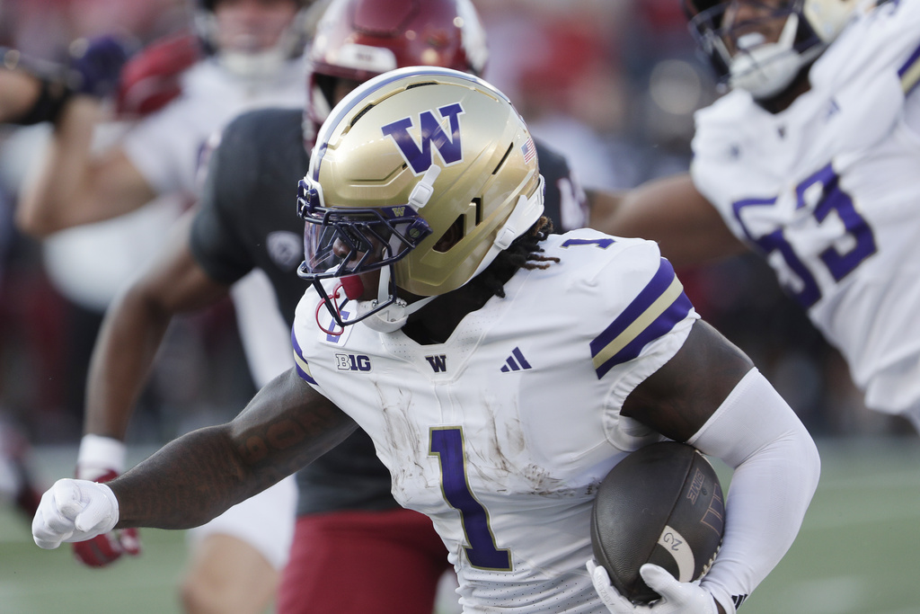 Washington running back Jonah Coleman (1) carries the ball during the first half of an NCAA college football game against Washington State, Saturday, Sept. 20, 2025, in Pullman, Wash. (AP Photo/Young Kwak)