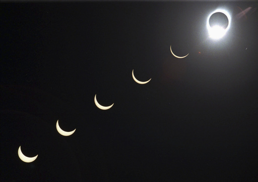 FILE - The progression of a total solar eclipse is seen in a multiple exposure photograph taken in 5-minute intervals, with the moon passing in front of the sun above Siem Reap in northwestern Cambodia, 225 kilometers (140 miles) from Phnom Penh, on Tuesday, Oct. 24, 1995. (AP Photo/Richard Vogel, File)