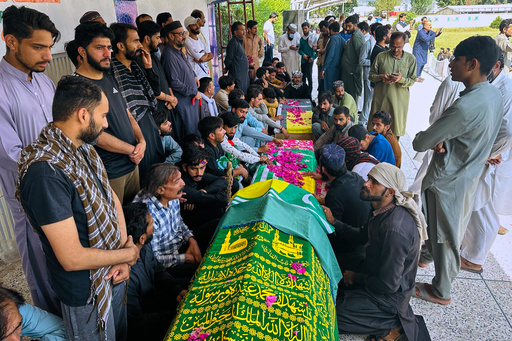 People sit around the bodies of three victims, who were killed in Wednesday's clashes between police and protestors, before their funeral prayers, in Muzaffarabad, the capital of Pakistani controlled Kashmir, Thursday, Oct. 2, 2025. (AP Photo/M.D. Mughal) People sit around the bodies of three victims, who were killed in Wednesday's clashes between police and protestors, before their funeral prayers, in Muzaffarabad, the capital of Pakistani controlled Kashmir, Thursday, Oct. 2, 2025. (AP Photo/M.D. Mughal)