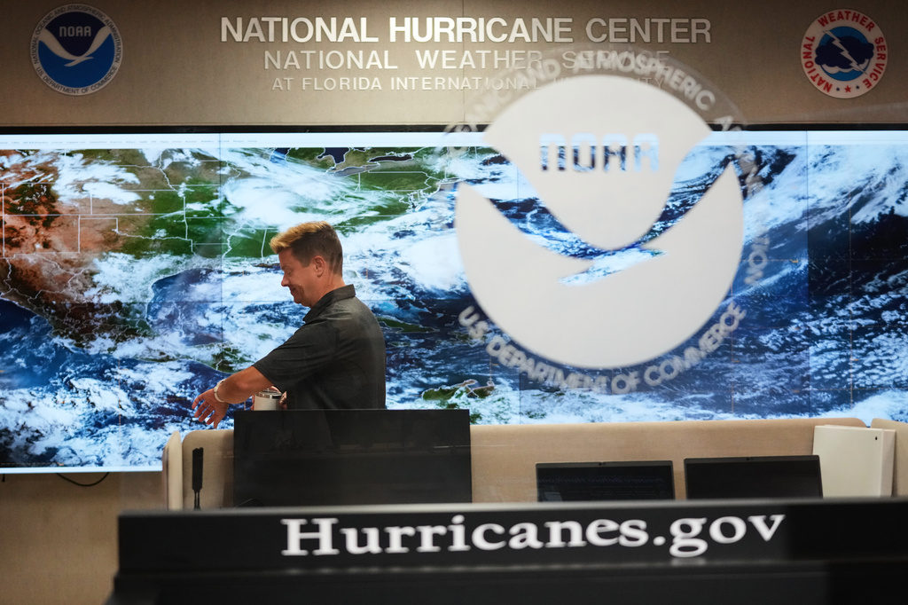 Robbie Berg, Warning Coordinator Meteorologist, works at the National Hurricane Center on the first day of hurricane season, Monday, June 1, 2026, in Miami. (AP Photo/Lynne Sladky)