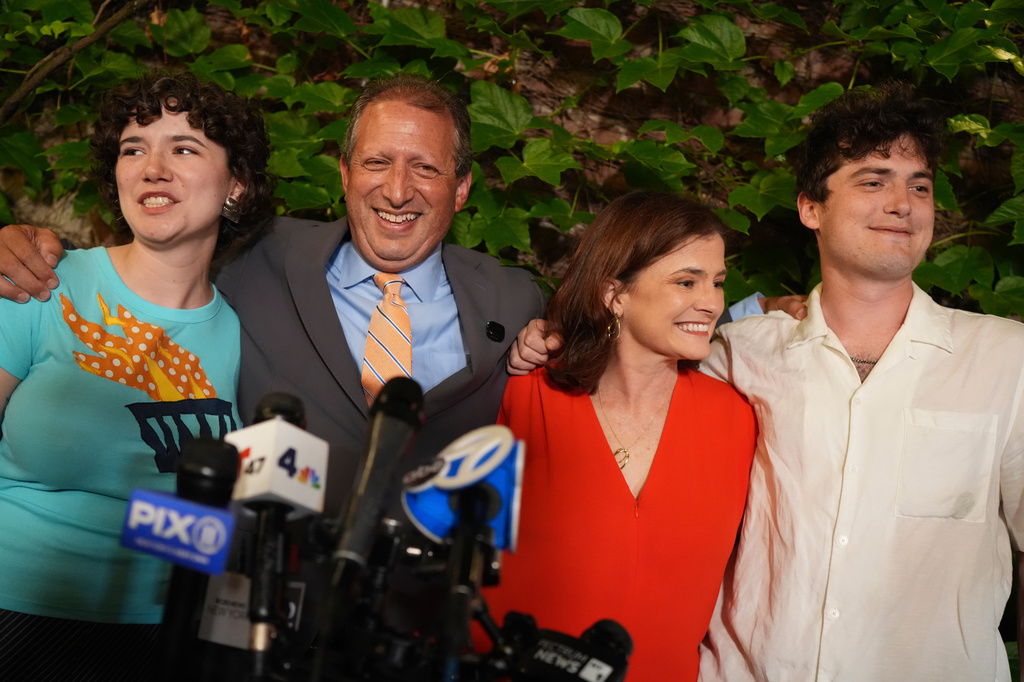 Democratic congressional candidate Brad Lander poses for photos with his family during an election night watch party Tuesday, June 23, 2026, in New York. (AP Photo/Ryan Murphy)