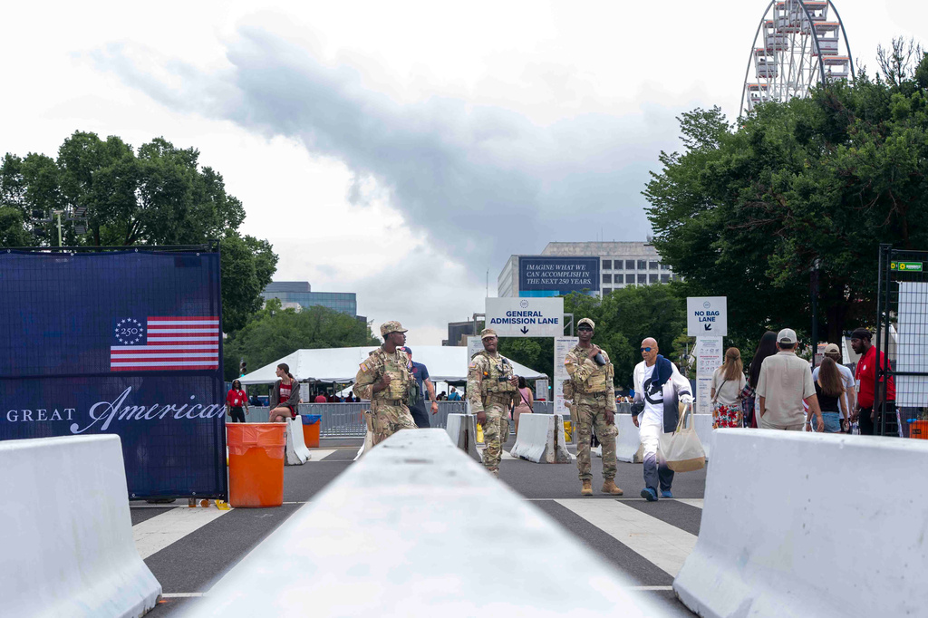 National Guard members stand at the entrance of the Great American State Fair on the National Mall, Saturday June 27, 2026, in Washington. (AP Photo/Jen Golbeck)