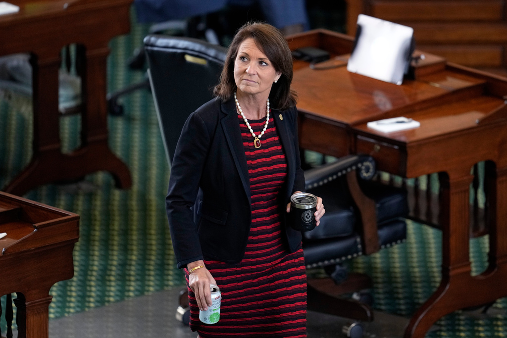FILE - Texas state Sen. Angela Paxton, R-McKinney, wife of suspended Texas state Attorney General Ken Paxton, walks through the Senate Chamber during the impeachment trial for her husband at the Texas Capitol, Sept. 16, 2023, in Austin, Texas. (AP Photo/Eric Gay, File)