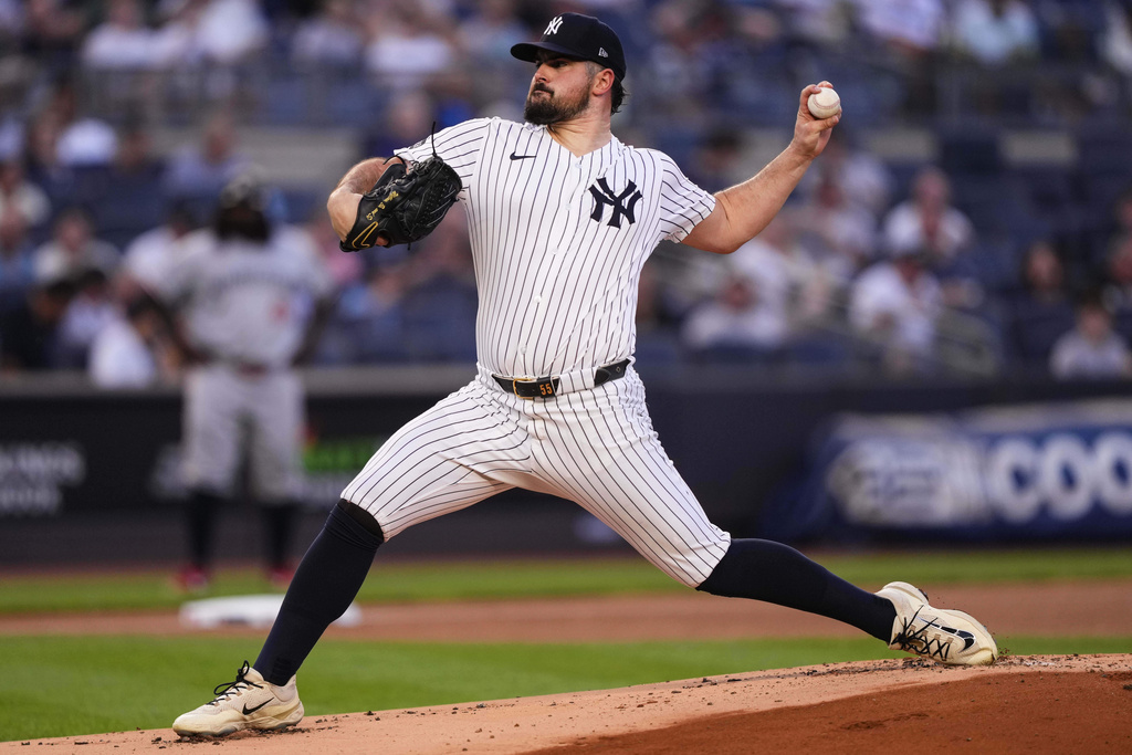 New York Yankees pitcher Carlos Rodón (55) throws during the first inning of a baseball game against the Minnesota Twins, Tuesday, Aug. 12, 2025, in New York. (AP Photo/Yuki Iwamura)