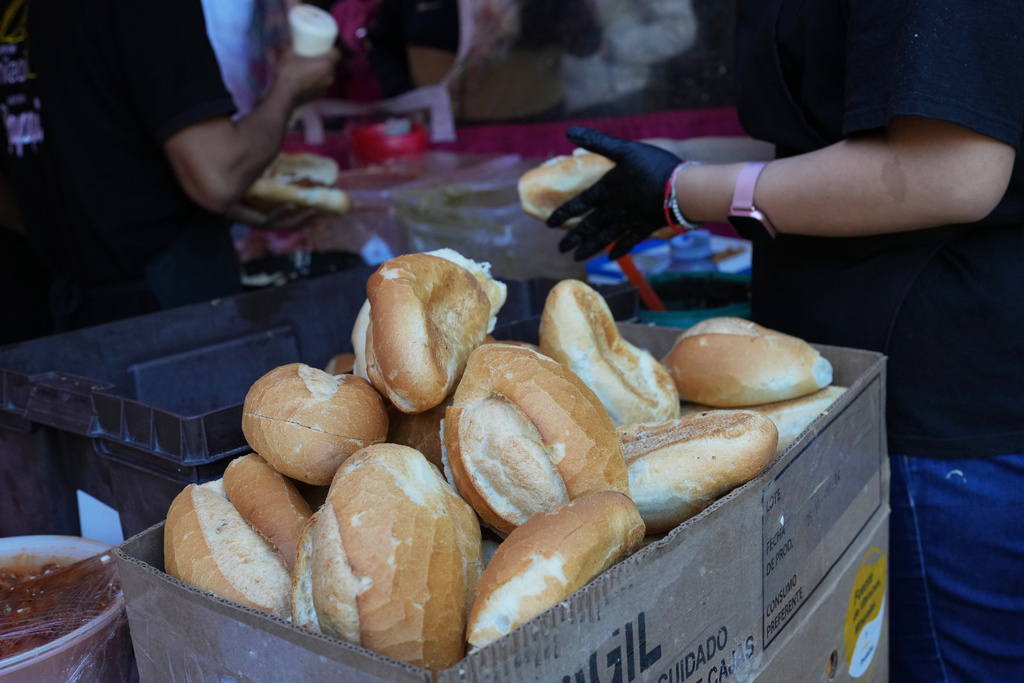 Bolillos, a traditional Mexican bread, sit for sale at a street stand in Mexico City, Thursday, Dec. 18, 2025. (AP Photo/Marco Ugarte)