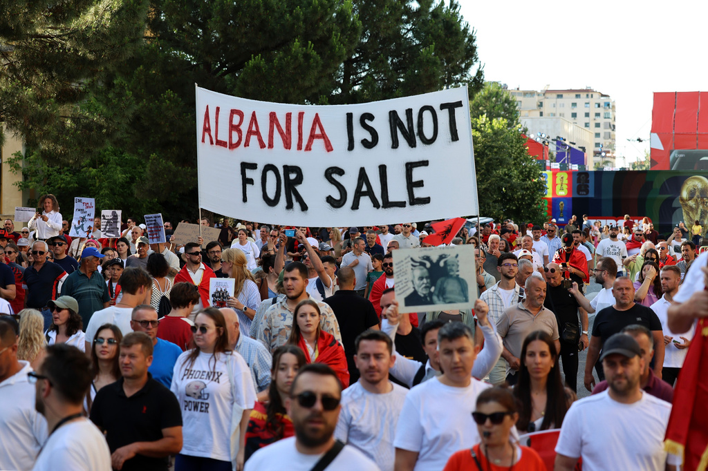 Protesters take part in a rally in Tirana, Saturday, June 13, 2026, against the construction of a massive coastal development project linked to Jared Kushner and Ivanka Trump at Narta lagoon area, western Albania. (AP Photo/Hameraldi Agolli)