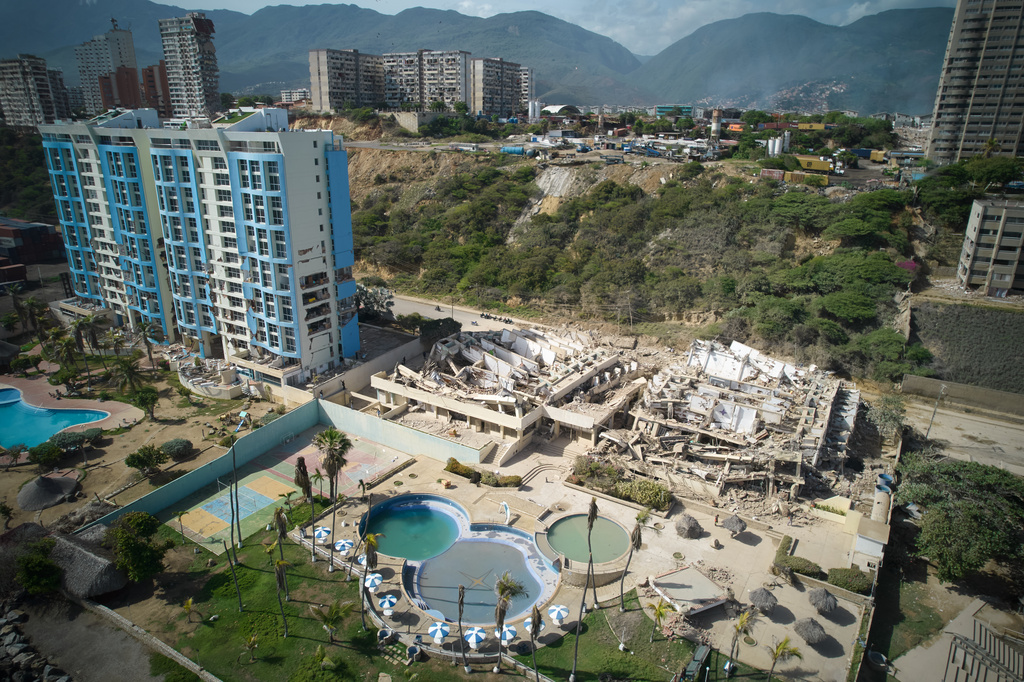 Collapsed buildings stand a day after earthquakes struck La Guaira, Venezuela, Thursday, June 25, 2026. (AP Photo/Juan Pablo Arraez)