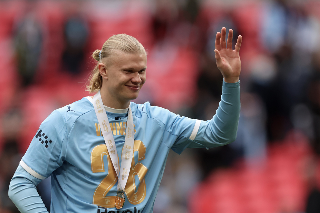Manchester City's Erling Haaland greets fans after the English FA Cup final soccer match between Chelsea and Manchester City in London, Saturday, May 16, 2026. (AP Photo/Richard Pelham)