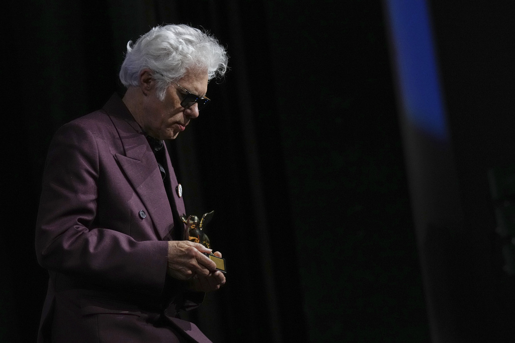 Director Jim Jarmusch accepts the Golden Lion for best film for 'Father Mother Sister Brother' during the awards ceremony of the 82nd edition of the Venice Film Festival in Venice, Italy, on Saturday, Sept. 6, 2025. (Photo by Alessandra Tarantino/Invision/AP)