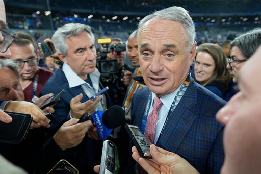 MLB commissioner Rob Manfred speaks prior to Game 2 of baseball's World Series between the Toronto Blue Jays and the Los Angeles Dodgers, Saturday, Oct. 25, 2025, in Toronto. (AP Photo/David J. Phillip) MLB commissioner Rob Manfred speaks prior to Game 2 of baseball's World Series between the Toronto Blue Jays and the Los Angeles Dodgers, Saturday, Oct. 25, 2025, in Toronto. (AP Photo/David J. Phillip)