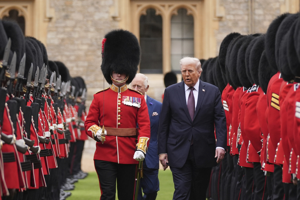 President Donald Trump and Britain's King Charles III inspect the guard of honor during an arrival ceremony at Windsor Castle, in Windsor, England, Wednesday, Sept. 17, 2025. (AP Photo/Evan Vucci)