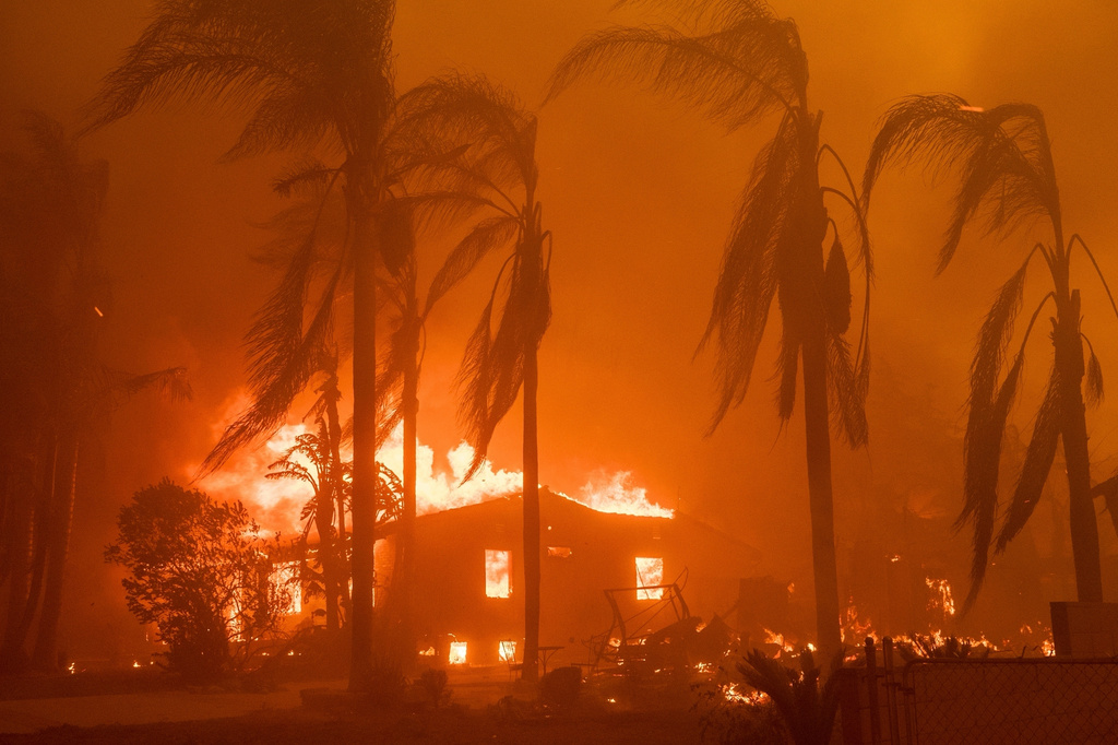 FILE - A home burns in the Eaton Fire in Altadena, Calif., Jan. 8, 2025. (AP Photo/Nic Coury, File)