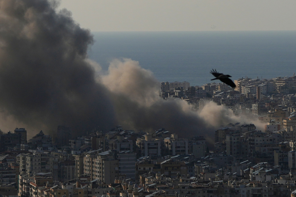 Smoke rises following Israeli airstrikes on Dahiyeh, a southern suburb of Beirut, Lebanon, Monday, March 2, 2026. (AP Photo/Hassan Ammar)
