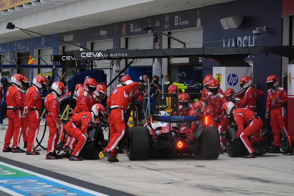 Ferrari driver Lewis Hamilton of Britain gets a pit service during the Miami Formula One Grand Prix auto race, Sunday, May 3, 2026, in Miami Gardens, Fla. (AP Photo/Rebecca Blackwell, Pool)