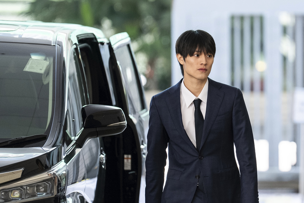 J-pop star Kenshin Kamimura arrives at the West Kowloon Magistrates' Courts to hear verdict over his indecent assault case in Hong Kong, Wednesday, August 13, 2025. (AP Photo/Chan Long Hei)