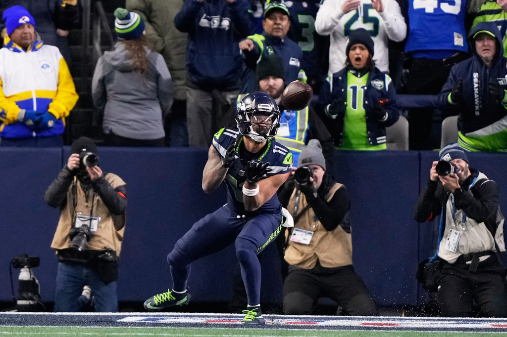 FILE - Seattle Seahawks wide receiver Jaxon Smith-Njigba (11) makes a touchdown catch during the first half of the NFC Championship NFL football game against the Los Angeles Rams, Sunday, Jan. 25, 2026, in Seattle. (AP Photo/Stephen Brashear, File)