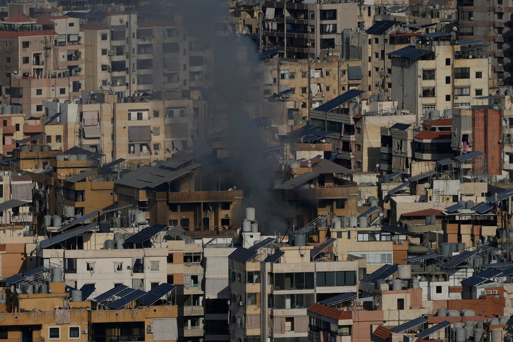 Smoke rises from an earlier Israeli airstrike in Dahiyeh, Beirut's southern suburbs, Lebanon, Friday, March 6, 2026. (AP Photo/Hussein Malla)