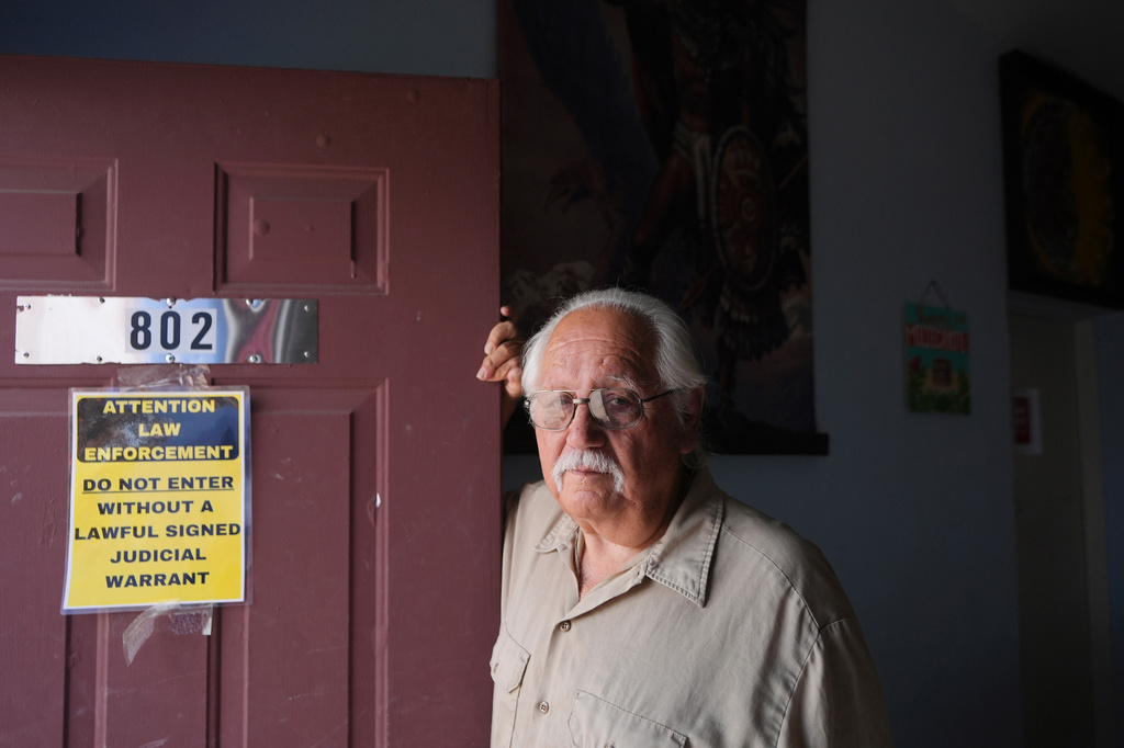 Salvador Reza, a longtime activist for the rights of day laborers, stands at the entrance of a community outreach facility, May 19, 2026, in Phoenix. (AP Photo/Ross D. Franklin)