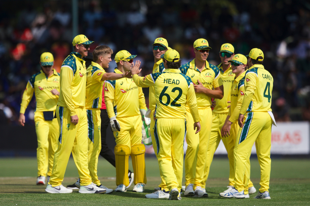 Australia players celebrate a wicket during the first One Day International cricket match between Zimbabwe and Australia in Harare, Zimbabwe, Tuesday, Sept.15, 2026. (AP Photo/Wonder Mashura)